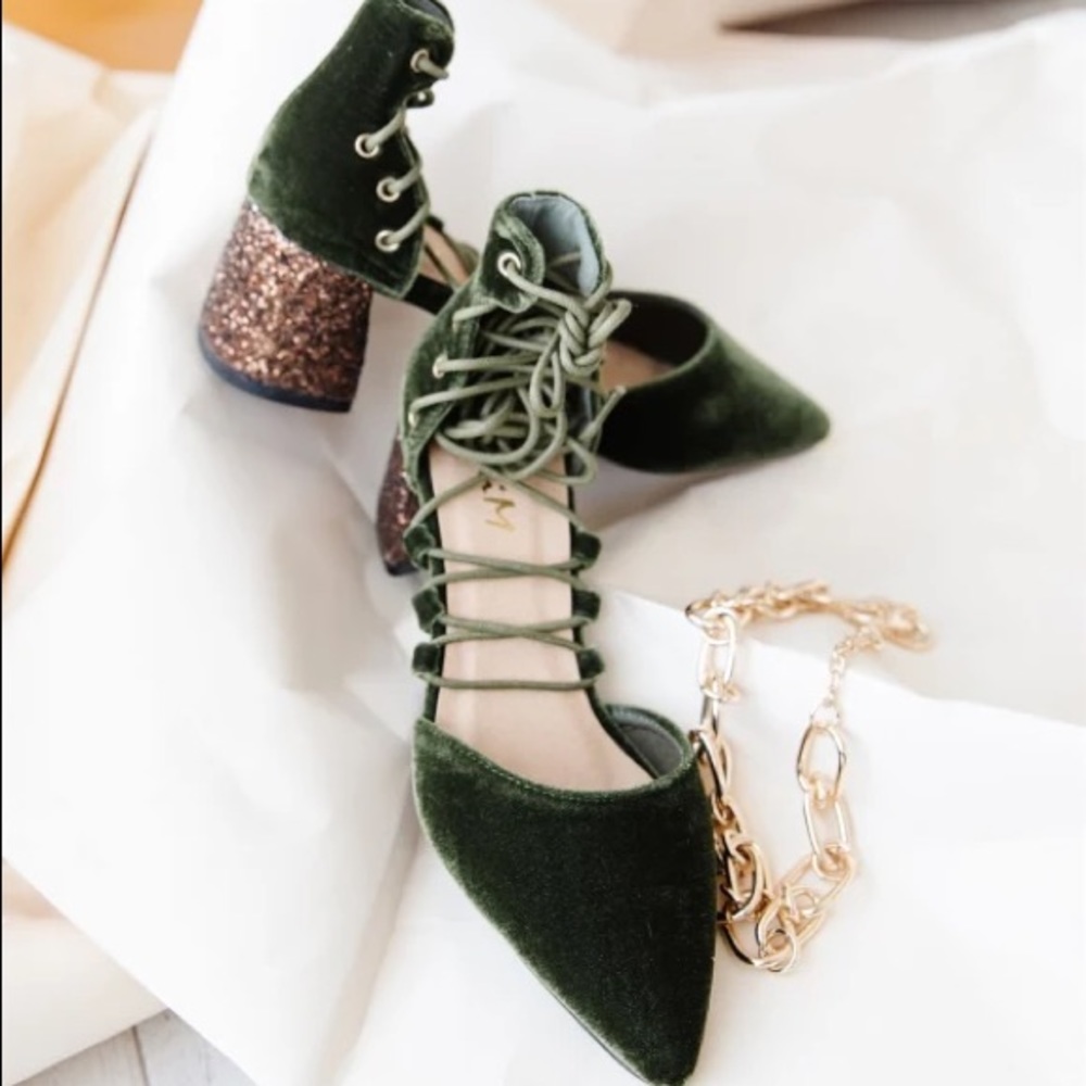 Pointed toe lace up block heels.